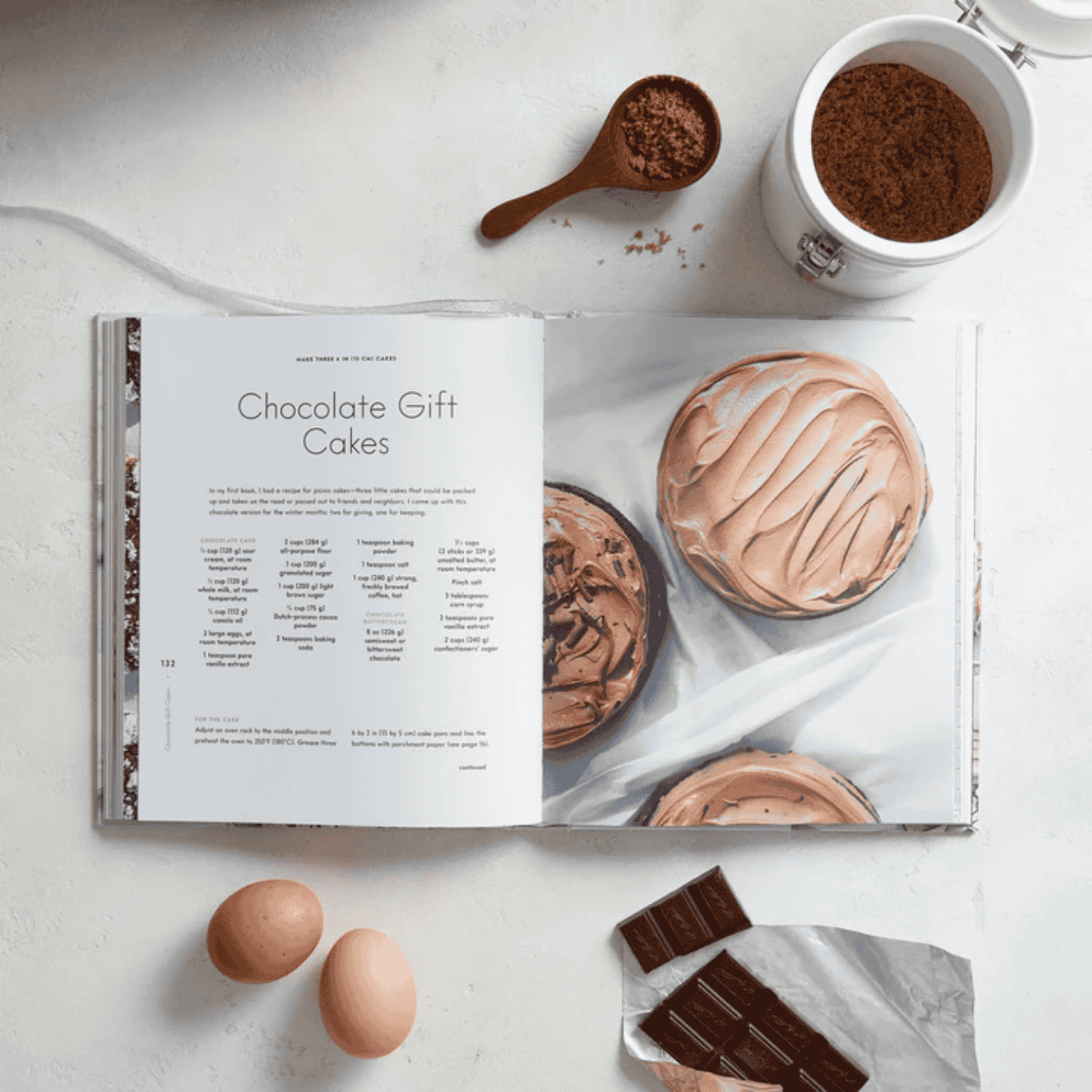 Baking For The Holidays cook book open to an example recipe of chocolate gift cakes