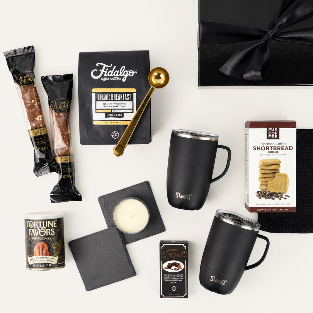 Collection of coffee-themed items including coffee packets, mugs, and a black box on a white background