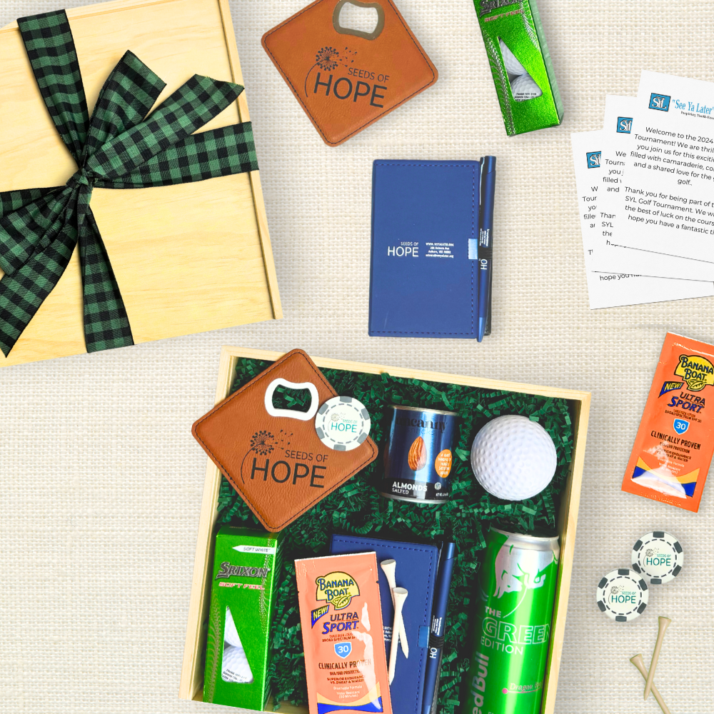 Collection of items including a gift box, bottle opener, notebook, and sports-related products on a textured surface.