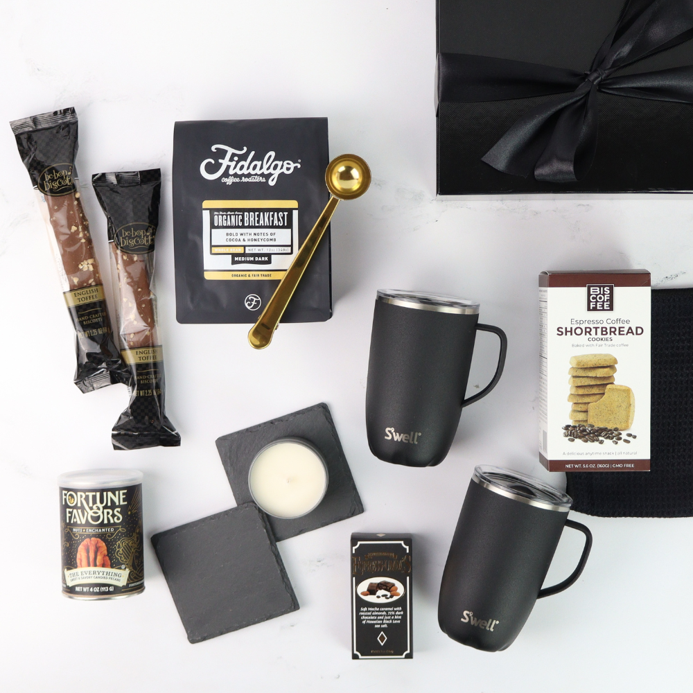 Collection of coffee-themed items including mugs, coffee packets, and a gift box on a white background.