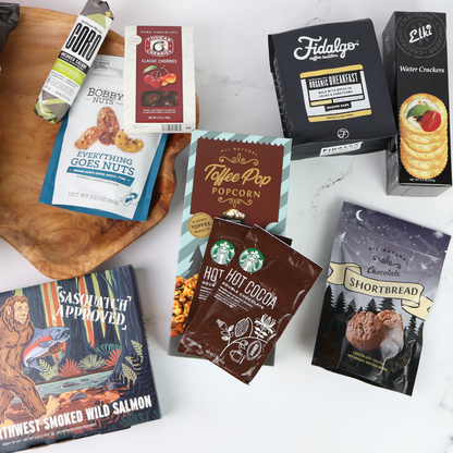 Assorted food products including snacks and coffee on a white surface