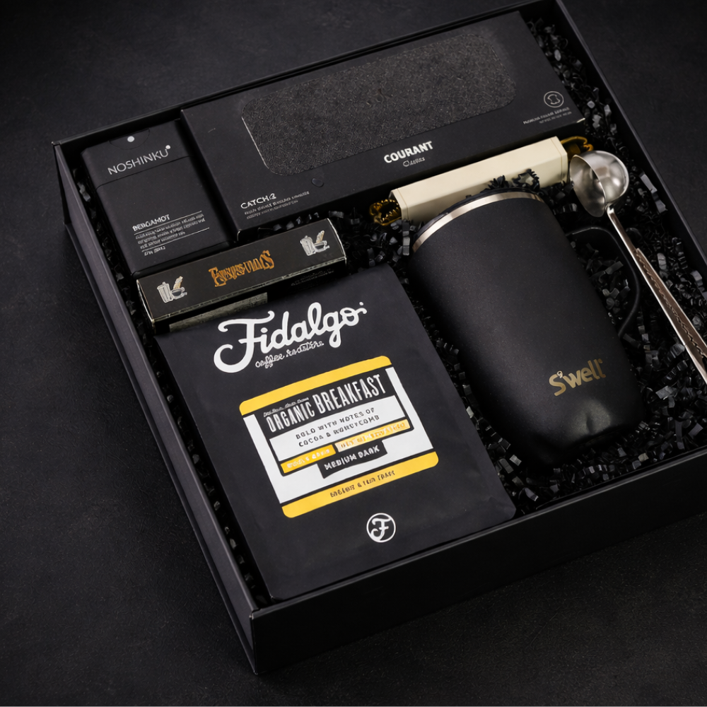 Coffee gift set with Fidalgo coffee packaging, a mug, and other items in a box.