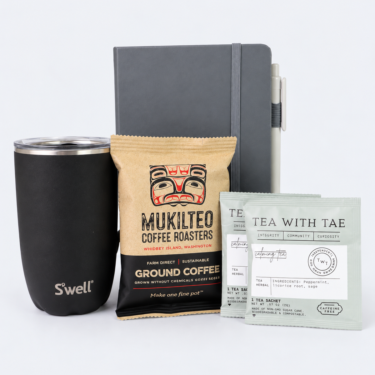 Workday Essentials coffee and tea gift set wrapped in clear cellophane with an emerald green satin bow, ready for corporate gifting or employee appreciation.
