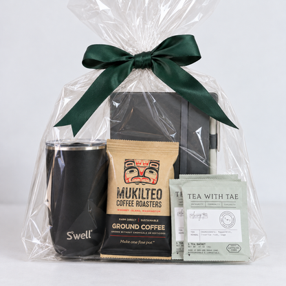 Workday Essentials gift set featuring black S'well insulated tumbler, gray notebook, Mukilteo ground coffee and Tea with Tae herbal tea sachets.